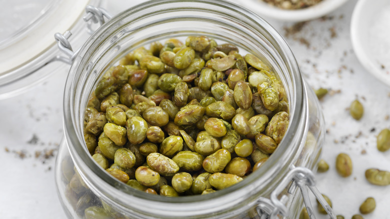 Salt and pepper roasted edameme beans in a glass jar