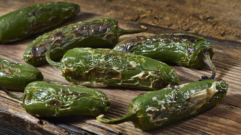 roasted jalapenos on wooden board