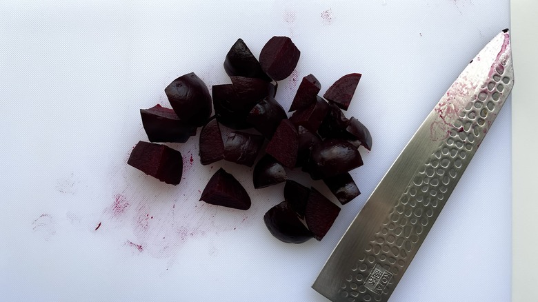 chopped cooked beets with knife