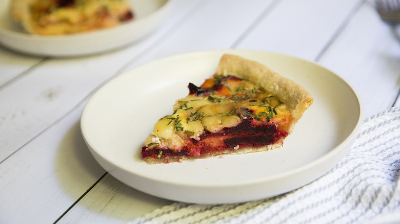 beet quiche slice on plate