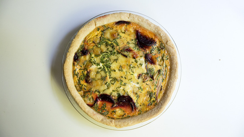 colorful baked quiche on table