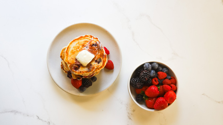 Plate with roasted berry pancakes