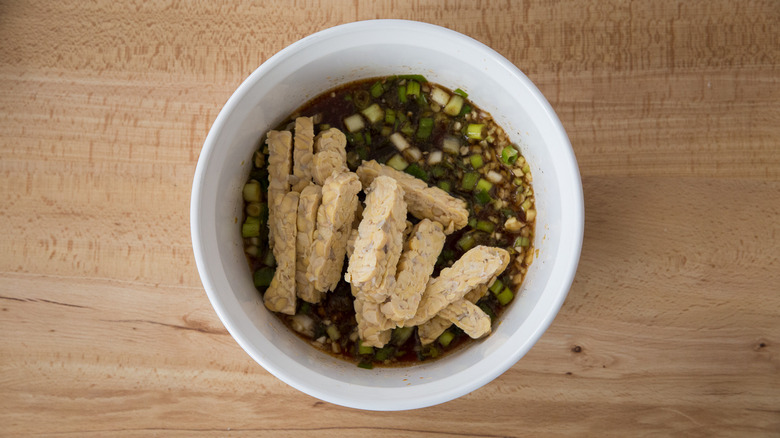 tempeh in bowl of marinade 