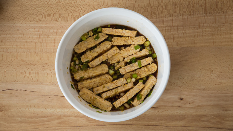 tempeh marinating in bowl 