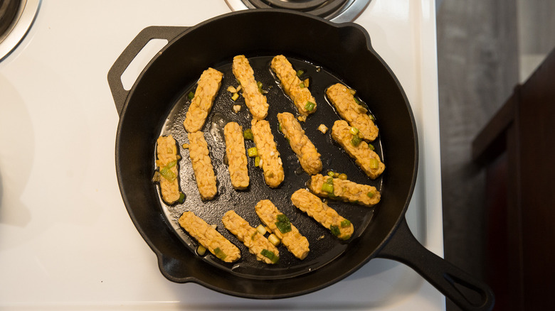 tempeh frying in skillet 