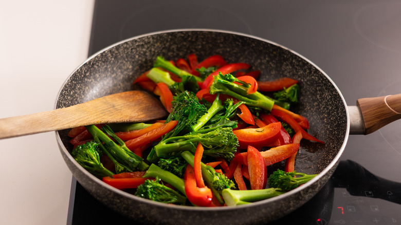 broccolini and peppers in pan