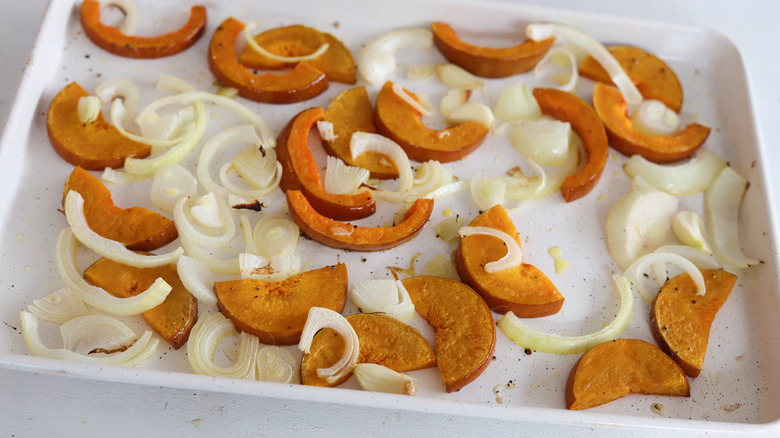 baked squash and onion on a sheet pan