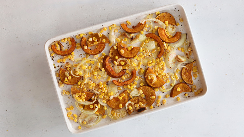 corn and squash on a baking sheet