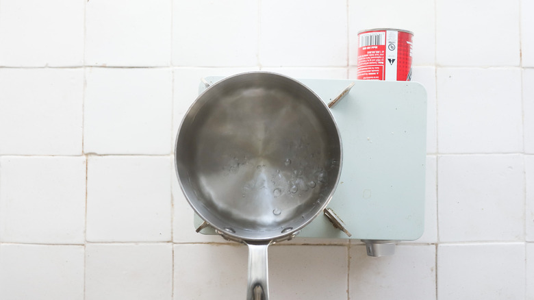 Small pot of water boiling