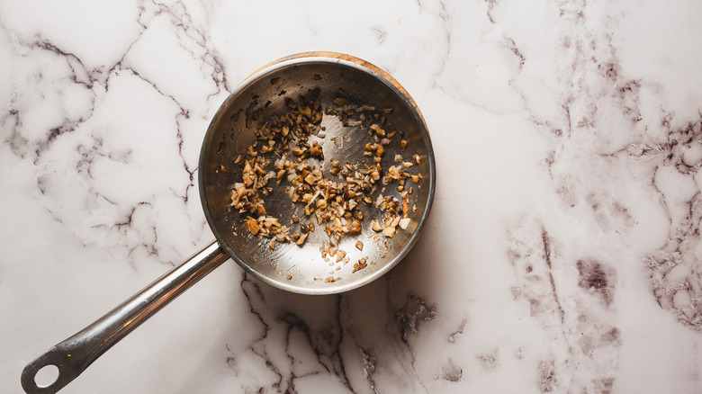 Sauteing mushrooms in a pan