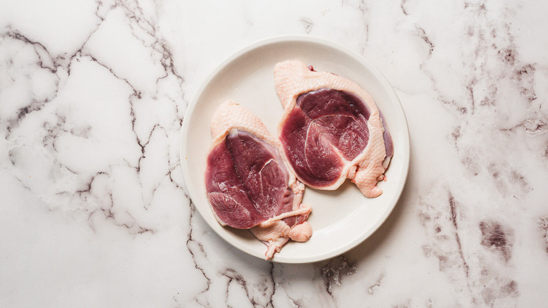 Two duck breasts cut open