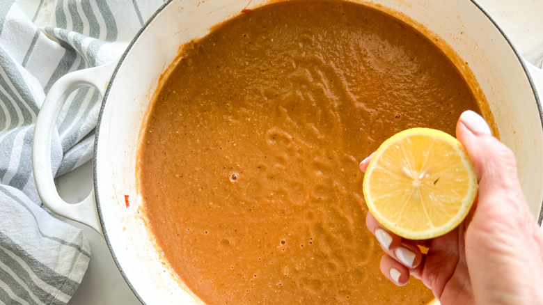 adding lemon to soup