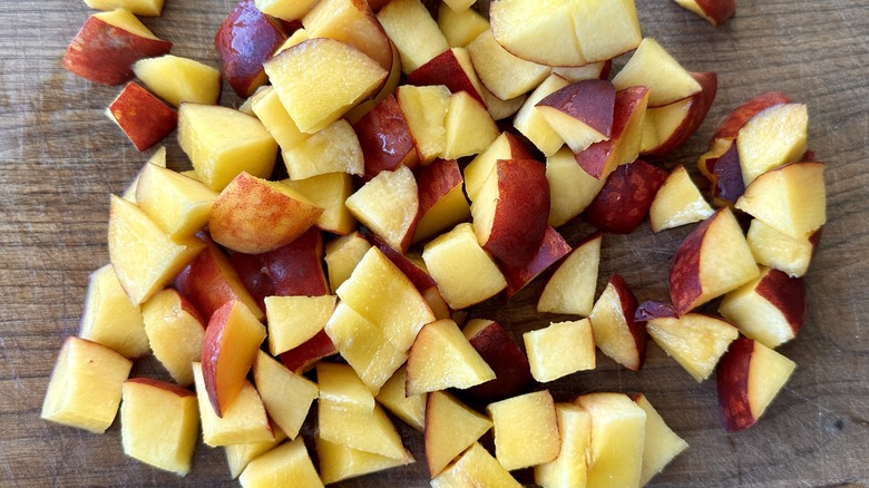 Cut peaches on cutting board