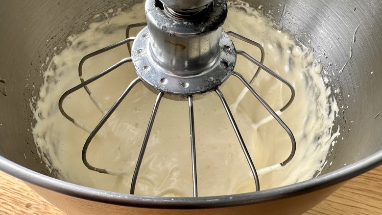 whipping egg mixture in bowl