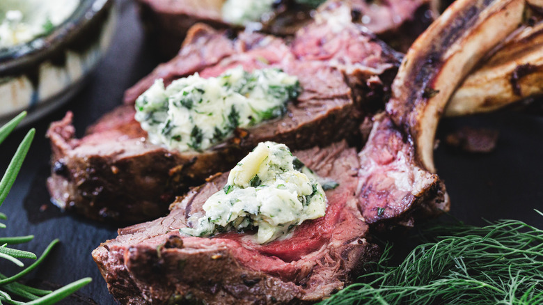 Two venison ribs with butter and herbs