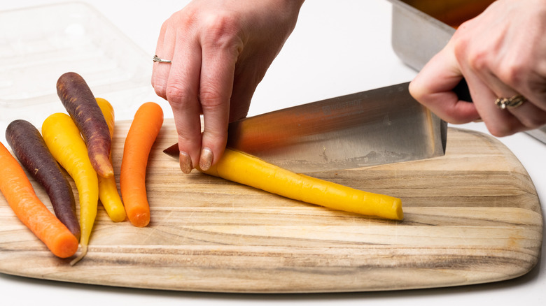 Slicing rainbow carrots 