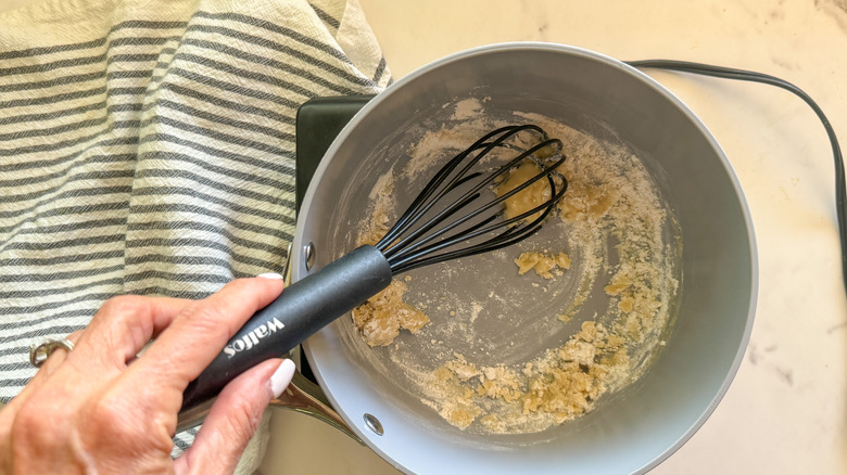 hand whisking the flour mixture