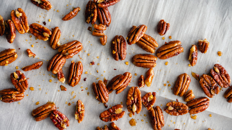 toasted pecans on parchment paper