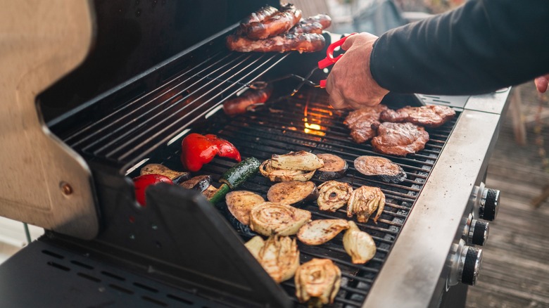 Meat, veggies on grill