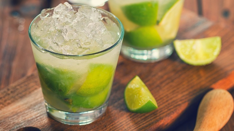 A Brazil Caipirinha cocktail with lime slices