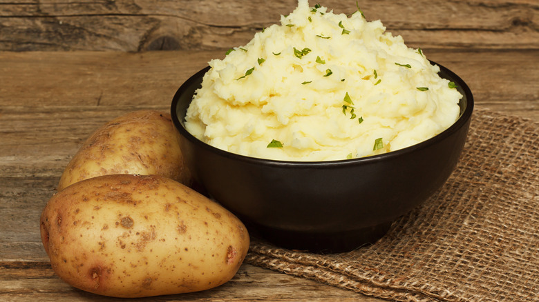 Potatoes and mashed potato in bowl