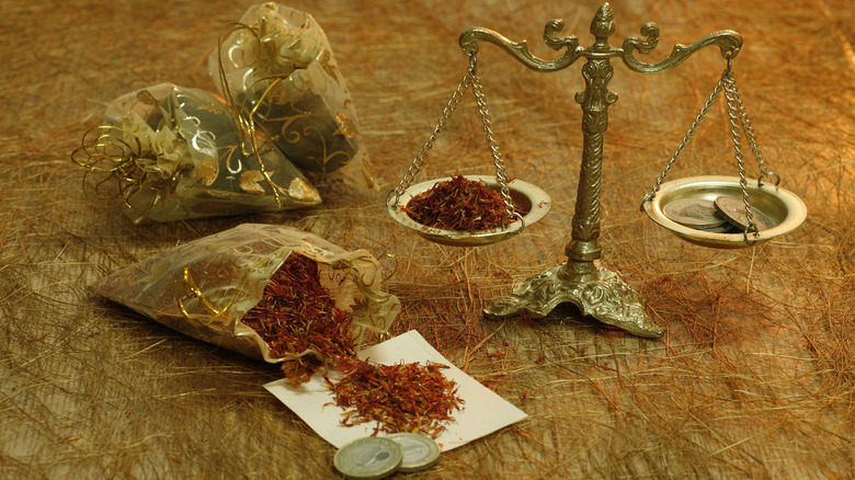 Saffron weighed against coins