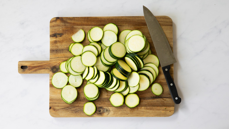 sliced zucchinis on board 