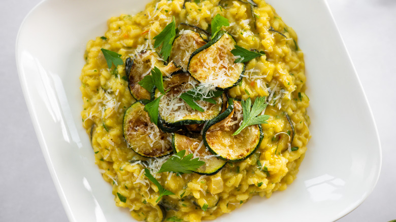 close up of saffron zucchini risotto on plate 