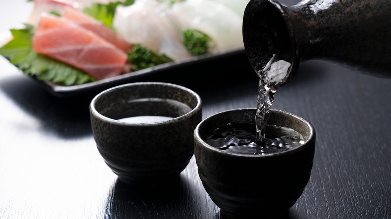 sake being poured into cups