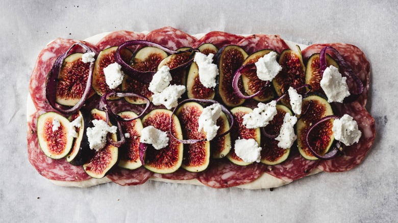 flatbread with salami and figs and onions and goat cheese