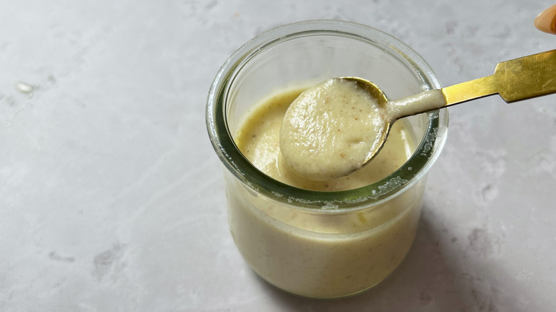 stirring dressing in jar