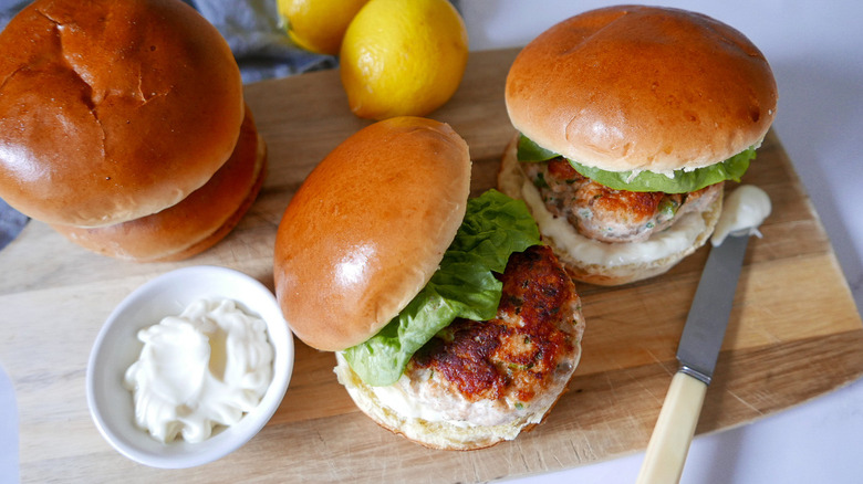 salmon burgers on cutting board