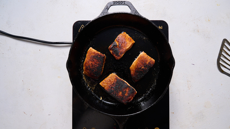 blackened salmon in skillet