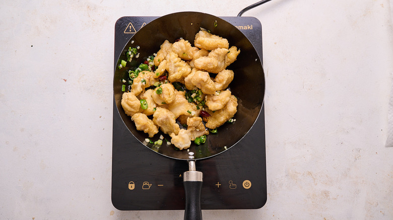 catfish and peppers in wok