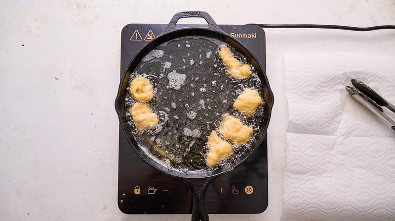 frying catfish in skillet