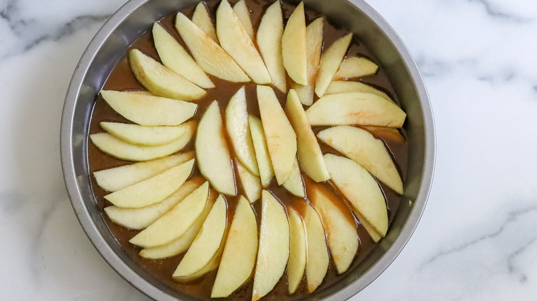 sliced apples in cake pan