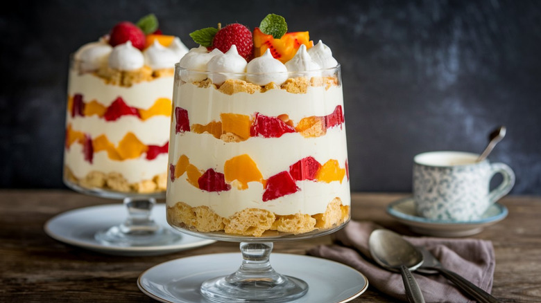 Two fruit trifles and a mug of something hot