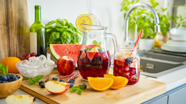 Pitcher of sangria surrounded by produce