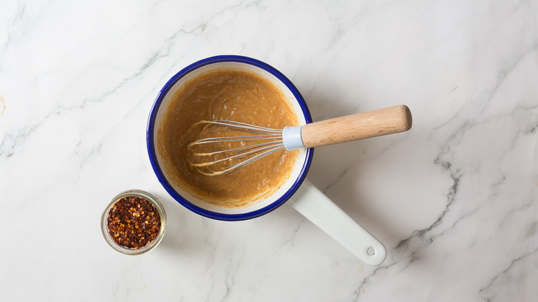 Saucepan with peanut sauce