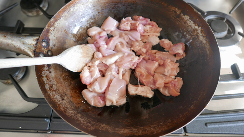 chicken thighs in a wok 