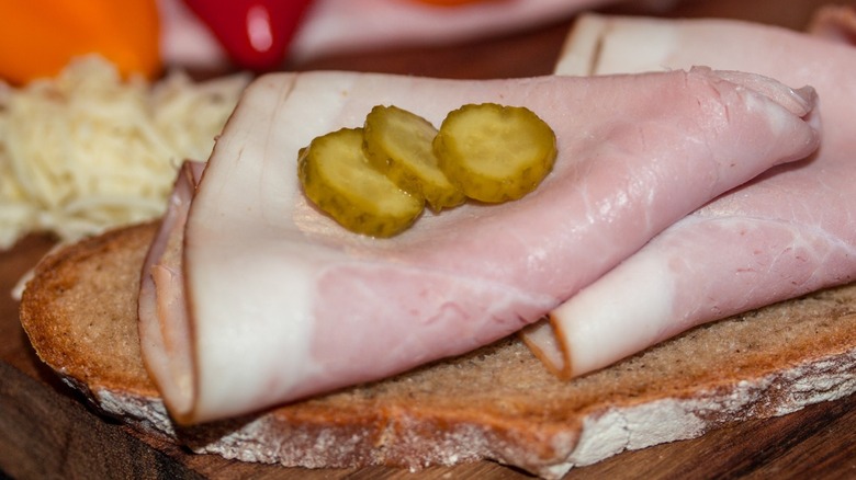 sliced ham with pickles on bread