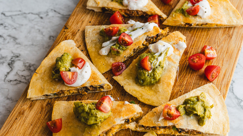 Slices of quesadilla on cutting board