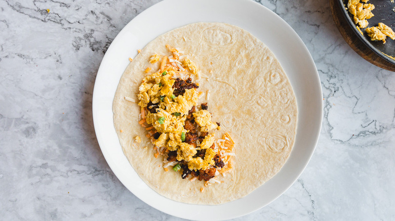 Open faced tortilla on white plate