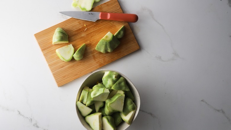 Cutting squash on board