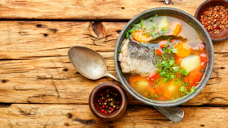 Stock with fish, veggies, and aromatics