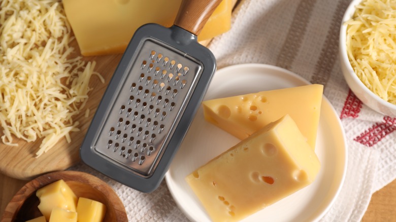 Flat grater with block of cheese