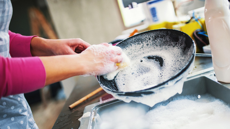 woman washing pan