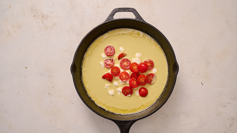 batter and toppings in skillet