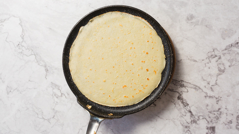 Cooked crepe in pan