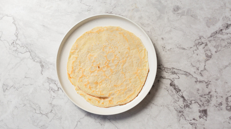 Cooked crepe on plate